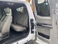 The interior of a 2017 Ford F-550 showing a spacious seating area with gray fabric seats and an open door