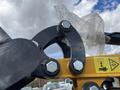 A close-up view of the attachment point on a 2024 AGT Mini Excavator featuring bolts and a circular clamp design