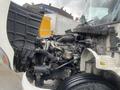 A 2008 Hino 268 with its hood lifted showing the engine compartment featuring various components and hoses