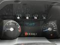 A close-up view of the dashboard of a 2011 Ford F-250 SD showing gauges for RPM speed and fuel levels alongside a digital display with odometer and timer readings