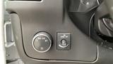 Control panel of a 2017 Chevrolet Express Quigley 4x4 featuring knobs for headlights and traction control settings