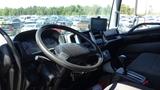 Interior view of a 2009 Hino 268 showcasing the steering wheel dashboard and control panel