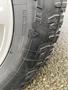 Close-up of a 2017 Ford F-150 tire showcasing the tread pattern and brand markings on the sidewall