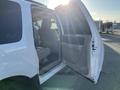 A 2013 Ford Expedition with an open rear door revealing the interior seating and dashboard