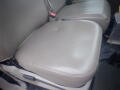 Gray vinyl seat of a 2008 Ford F-550 with visible wear and slight creasing