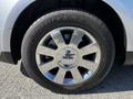 Close-up of a shiny silver wheel rim with a Lincoln emblem and Good Year tire on a 2013 Lincoln MKT