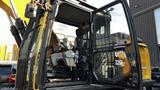 2018 Cat 326F Track excavator with an open cab showing the operator seat controls and interior layout