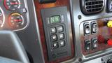 Close-up of the gear shift panel in a 2017 Freightliner M2 106 featuring buttons for drive modes including forward reverse and neutral