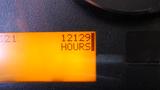 Display screen showing a digital readout of 12129 hours on a 2013 International 7400 Workstar vehicle