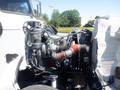 A 2008 Peterbilt 335 truck engine showing the components including the turbocharger and various tubes and hoses