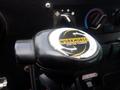 Black gear shift knob with a circular logo featuring the text Workhorse Custom Chassis in yellow and black colors