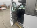 A 2017 Chevrolet Express with an open driver's side door showcasing the interior and dashboard