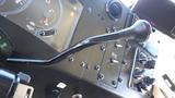 The interior dashboard of a 2005 Morgan Olson Workhorse with a gear shift lever and various control knobs and gauges