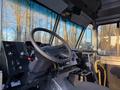 The interior of a 2017 Freightliner M Line featuring a steering wheel dashboard with controls and a driver's seat positioned to the right