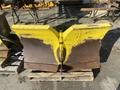 A yellow 2008 Camoplast SW 4S snow plow blade with visible wear and a metal base plate mounted on a wooden pallet