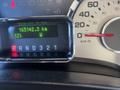 A digital dashboard display of a 2013 Ford Expedition showing the odometer reading 165142.3 km and the temperature 12°C