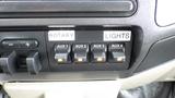 Dashboard controls for a 2008 Ford F-450 SD featuring four auxiliary switches labeled AUX 1 to AUX 4 with lights indicating their status