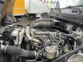 The image shows the engine compartment of a 2008 Hino 268 with various components including pipes filters and a large air intake system
