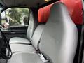 Interior of a 2008 Ford F-750 showing two gray cloth front seats with seatbelts and a steering wheel in view