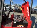 A red 2013 Raymond forklift with a visible control panel and battery compartment featuring multiple batteries