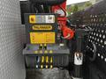 Control panel of a Palfinger crane mounted on a 2014 Ford F-550 with various levers and buttons for operating the crane