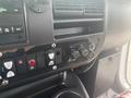 Interior controls of a 2017 Chevrolet Express including air conditioning and various switches and knobs for vehicle features