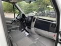 Interior of a 2017 Mercedes-Benz Sprinter featuring a steering wheel dashboard and modern controls with fabric seats