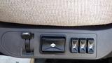 The image shows the control panel of a 2017 Freightliner M2 106 featuring four switches and a key slot on a textured surface