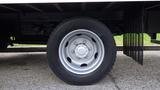 A close-up of the wheel of a 2016 Hino 195 truck showing a silver rim and a black tire with visible tread patterns