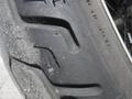 Close-up of the tire tread on a 2009 Harley-Davidson Flstc showcasing detailed patterns and texture