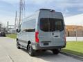 A 2019 Mercedes-Benz Sprinter van in gray parked with its rear facing the camera showcasing its sleek design and large cargo space