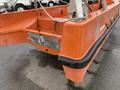 A bright orange 2008 Fassmer 20 Foot Fast Rescue boat with a flat bow and multiple attachment points for safety equipment