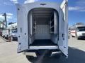 A 2019 Ford F-350 SD with an open rear cargo area displaying shelves and a flat floor