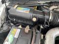 A close-up view of the engine compartment of a 2010 Ford F-550 featuring visible components like the battery and air intake system