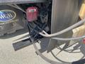 Close-up of hydraulic hoses connected to the rear of a 2010 Ford F-550 truck