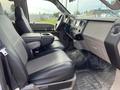 Interior of a 2010 Ford F-550 showing leather seats and dashboard with controls and center console