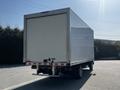 A 2020 Hino 195 box truck viewed from the rear with a plain white cargo area and dual rear wheels