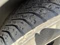 Close-up of a worn tire tread on a 2016 Audi A3 showing visible grooves and signs of wear