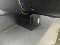 A black heating unit installed under the driver's seat of a 2017 Chevrolet Express