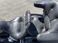 Close-up of the seats on a 2004 Harley-Davidson Flhtcui showing black leather with visible stitching and cushioning details