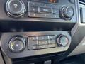 Dashboard controls of a 2019 Ford F-350 SD featuring audio system buttons climate controls and a rotary knob for temperature adjustment