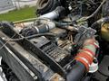 2014 Kenworth T370 engine with visible components including hoses and mechanical parts showing signs of wear and dirt