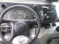 Close-up of the steering wheel and dashboard of a 2007 Morgan Olson Workhorse W42 displaying gauges gear shifter and control buttons