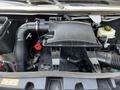 A 2022 Mercedes-Benz Sprinter engine compartment showing the air intake system and coolant reservoir with various hoses and components visible