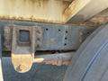 Close-up of a rusted metal frame section of a 2010 Freightliner MT45 Garbage Truck showing bolts and multiple holes for fastening