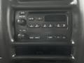 Dashboard control panel of a 2005 GMC C5 Duramax featuring radio and audio controls with buttons for tuning and volume