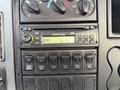 Dashboard of a 2007 International 4200 featuring a radio display with AM FM options and several control buttons for various functions
