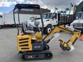 A yellow 2024 AGT Mini Excavator with a black cab and tracks features a digging arm with a claw attachment and two seat cushions inside the cockpit