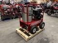 A red 2024 Magnum 4000 Hot Water Pressure Washer mounted on a wooden pallet with a silver tank and a black engine on wheels