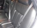 Interior of a 2008 Cadillac Limousine showing black leather seating with seatbelts